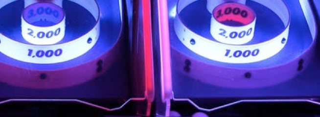 Picture of arcade game with neon lights